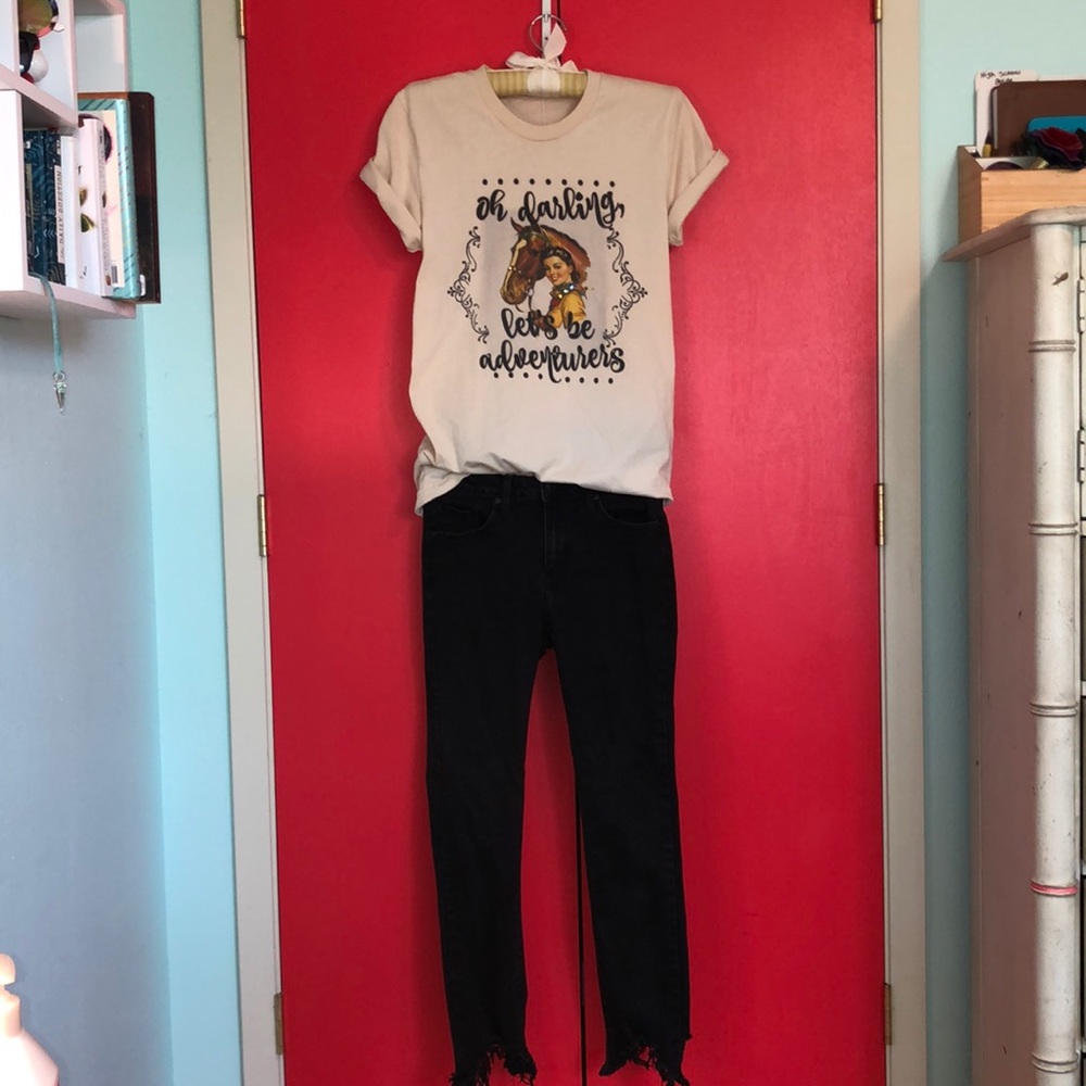 A custom screened top w/ black fringe pants